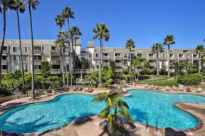 an image of a swimming pool at a resort at Steps to Shore Condo with Resort Perks in Oceanside in Oceanside