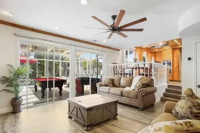 a living room with a couch and a table at Charming Villa with Backyard Oasis Close to Beach in Laguna Hills