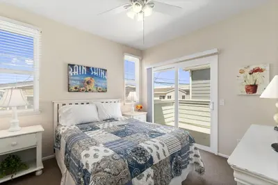 a bedroom with a bed and a window at 6Br Oceanview Getaway Steps From 27Th St Beach By Beachview Rentals in Newport Beach