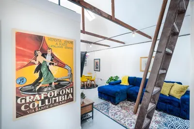 a room with a poster of a woman in a green dress at Comfy Bay Park Cottage close to Everything! in San Diego