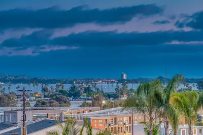 a view of a city with buildings and palm trees at Comfy Bay Park Cottage close to Everything! in San Diego