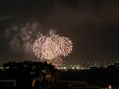 a firework display in the sky at night at Comfy Bay Park Cottage close to Everything! in San Diego