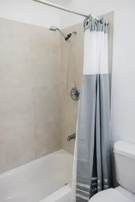 a bathroom with a shower with a shower curtain at Mira Mesa Private Suite with Private Bath & Entry #2 in San Diego