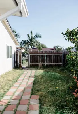 a backyard with a fence and a walkway at Mira Mesa Private Suite with Private Bath & Entry #2 in San Diego
