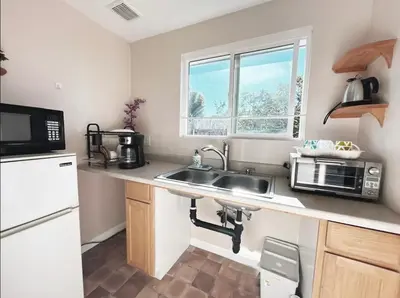 a small kitchen with a sink and a microwave at Mira Mesa Private Suite with Private Bath & Entry #2 in San Diego