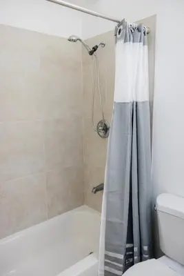 a shower with a shower curtain in a bathroom at Mira Mesa Private Suite with Private Bath & Entry #2 in San Diego