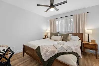 a bedroom with a bed with two towels on it at NEW! Hot TubPoolFire Pit10 Mins to Beach in San Diego