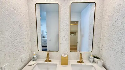 a bathroom with two sinks and a mirror at Location! Location! Location! Walk Everywhere! in Oceanside