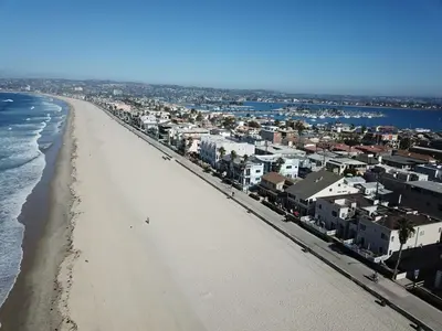 an aerial view of a beach with houses and condos at Ocean Front On Beach! -2 Master BR, 2 Full BA, Patio!, AC, Parking, Close to All in San Diego