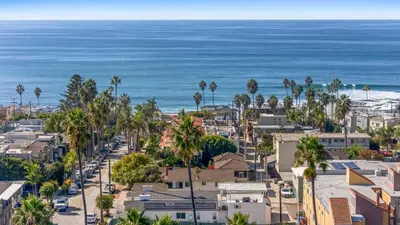 an aerial view of a city with palm trees and the ocean at Luxury La Jolla Beach Retreat - Steps to Windansea in San Diego
