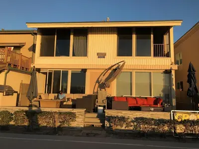 a yellow house with a living room at Ocean Front Beauty right on Best Beach in Mission Beach, San Diego! in San Diego