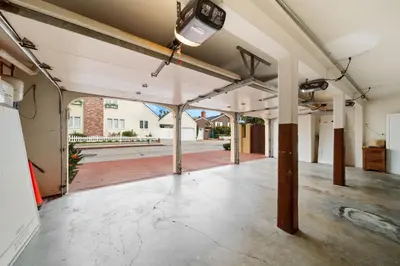 an empty garage with white walls and ceilings at Lush by the Sea in San Diego