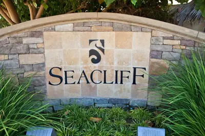 a sign that says seahrift on a stone wall at SeaCliff Costa Pacifica -1310 in Oceanside