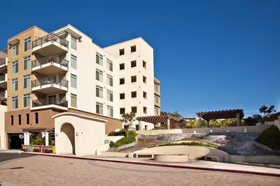 a large white building on a city street at SeaCliff Costa Pacifica -1310 in Oceanside