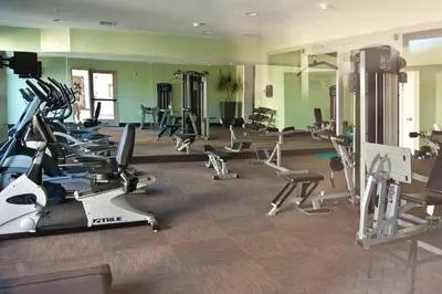 a gym with a lot of treadmills and exercise equipment at SeaCliff Costa Pacifica -1310 in Oceanside