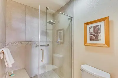 a bathroom with a glass shower with a toilet at Pool and Tennis Court Access Borrego Springs Condo in Borrego Springs