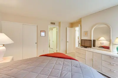 a bedroom with a large bed and a television at Pool and Tennis Court Access Borrego Springs Condo in Borrego Springs