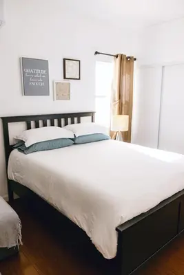 a bedroom with a large white bed and a window at Mira Mesa Private Suite with Private Bath & Entry #1 in San Diego