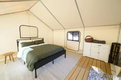 a bedroom with a bed in a tent at Boutique Nature Retreat in the Palomar Mountains in Pauma Valley