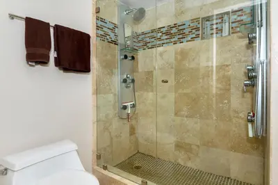 a bathroom with a shower with a toilet at 5N-53 Beach Bliss Ocean Views in Oceanside