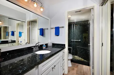 a bathroom with a sink and a shower at 501P-5 Panoramic Ocean & Pier Views in Oceanside
