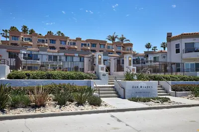 a building with a sign that says sun watch at 501P-5 Panoramic Ocean & Pier Views in Oceanside
