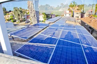 a roof with blue solar panels on it at Suite with Rooftop Deck and Ocean Views in Mission Bay in San Diego