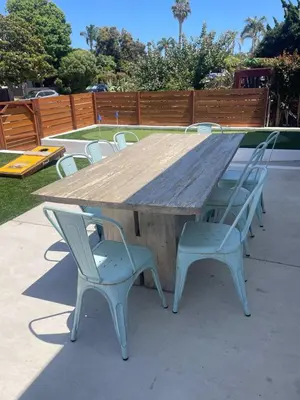 a large wooden table with chairs around it at Spectacular Coastal Farmhouse 4BR in Ocean Beach in San Diego