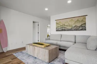 a living room with a couch and a coffee table at Spectacular Coastal Farmhouse 4BR in Ocean Beach in San Diego