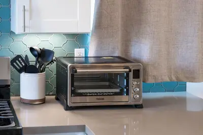 a toaster oven sitting on a counter in a kitchen at Modern Urban Escape Rooftop & Walkable Fun in San Diego