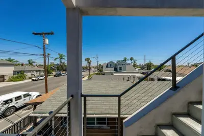 a view from the balcony of a house with a roof at Modern Urban Escape Rooftop & Walkable Fun in San Diego