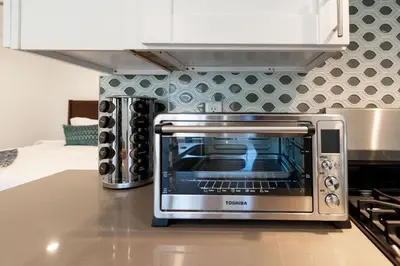 a toaster oven sitting on a counter in a kitchen at Stylish Studio with Big Patio in San Diego