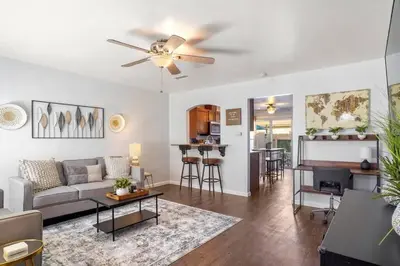 a living room with a couch and a ceiling fan at Inviting 2-BR Condo in the heart of Imperial Beach in Imperial Beach