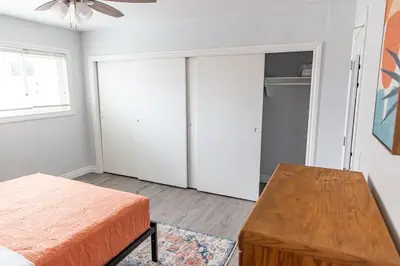 a bedroom with a bed and a closet at Vibrant Imperial Beach Oasis in Imperial Beach