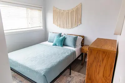 a small bedroom with a bed and a window at Vibrant Imperial Beach Oasis in Imperial Beach