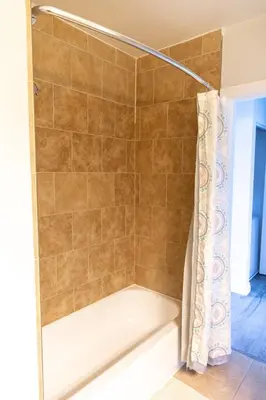 a shower with a tub and a shower curtain at Vibrant Imperial Beach Oasis in Imperial Beach