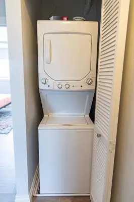 a small white washer and dryer in a closet at Vibrant Imperial Beach Oasis in Imperial Beach