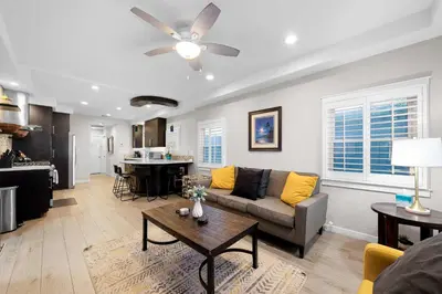 a living room with a couch and a table at Relaxing Beach Bungalow in San Diego