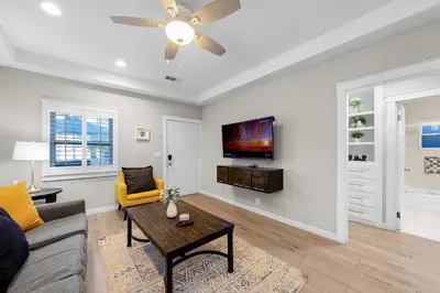 a living room with a couch and a table at Relaxing Beach Bungalow in San Diego