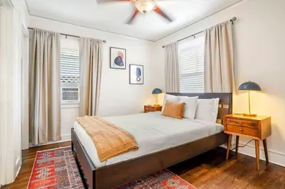 a bedroom with a bed and a ceiling fan at Adorable Quirky Hideaway BIG Private Enclosed Yard in San Diego