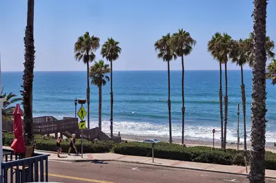 a view of a beach with palm trees and the ocean at 152-6 S Pacific Fantastic Ocean View in Oceanside