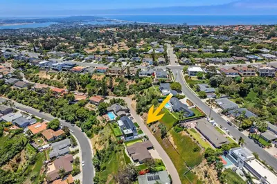 an aerial view of a city with houses and a road at Designer Canyon House in La Jolla in San Diego