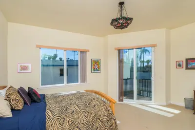 a bedroom with a bed and a window at Oceanview Beach Home - 209W in Oceanside