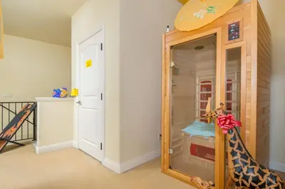 a room with a mirror and a giraffe toy at Oceanview Beach Home - 209W in Oceanside
