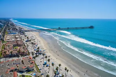 an aerial view of a beach with a pier at Oceanview Beach Home - 209W in Oceanside