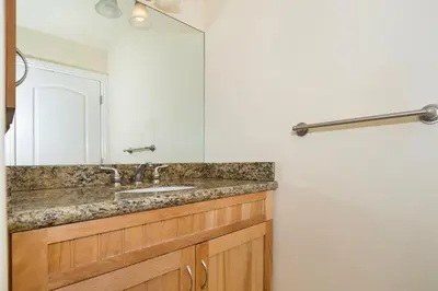a bathroom with a sink and a mirror at Oceanview Beach Home - 209W in Oceanside