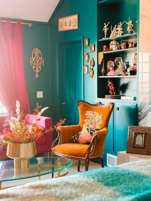 a living room with a chair and a glass table at 6BR Enchanted Estate on 5 Acres Pool & Mini Horses in Bonsall