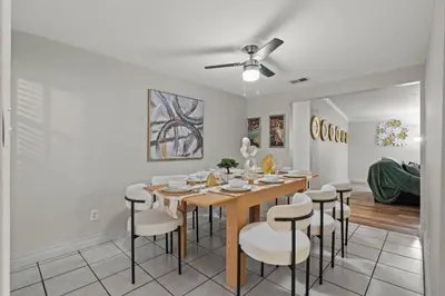 a dining room with a table and chairs at Entire Private Home with 4 Bedrooms 2 Bathrooms, 6 Beds, Hot Tub, King Bed, 6 Parking, Big Yard, Available Now in Spring Valley