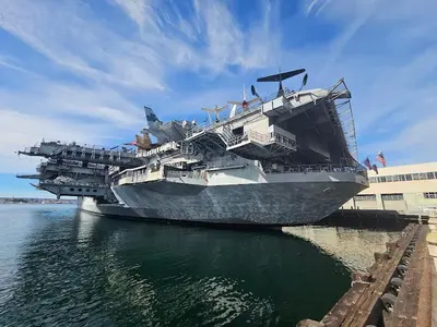 a large cruise ship is docked in the water at Entire Private Studio with King Bed, Bathroom, 1 Parking, Available Now in Spring Valley