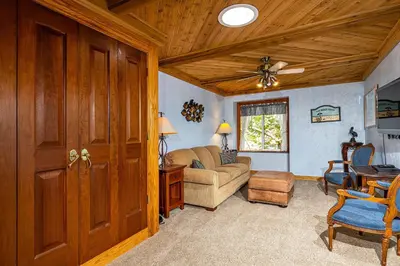 a living room with a couch and a table at North Coast Village Penthouse A306 in Oceanside